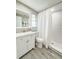 Bright updated bathroom with white vanity, shower, and toilet at 3310 W 63Rd W St, Bradenton, FL 34209