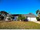 Charming single-story home with a well-maintained lawn and mature landscaping at 3310 W 63Rd W St, Bradenton, FL 34209