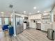 Modern kitchen with stainless steel appliances and white cabinets at 3310 W 63Rd W St, Bradenton, FL 34209