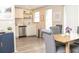 Open concept kitchen with white cabinets and dining area at 3310 W 63Rd W St, Bradenton, FL 34209