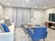 Living area with a cozy atmosphere, featuring comfortable furniture and large windows at 3310 W 63Rd W St, Bradenton, FL 34209