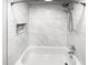 Bathroom with new tub and marble tile at 736 Mac Crillus Rd, Largo, FL 33770