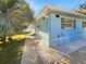 Side view of charming light blue house at 736 Mac Crillus Rd, Largo, FL 33770