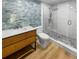 Modern bathroom with walk-in shower and wood vanity at 736 Mac Crillus Rd, Largo, FL 33770