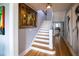 Elegant staircase with white risers and hardwood floors at 2041 Beach Dr Se, St Petersburg, FL 33705