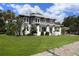 Two-story craftsman home with gray siding and white trim at 2041 Beach Dr Se, St Petersburg, FL 33705