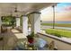Spacious front porch with tiled floor, seating area, and bay view at 2041 Beach Dr Se, St Petersburg, FL 33705