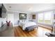 Bright main bedroom with hardwood floors, bay view windows, and stylish decor, offering a serene retreat at 2041 Beach Dr Se, St Petersburg, FL 33705