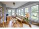 Bright sunroom featuring natural light, hardwood floors and cozy seating offering a tranquil space for relaxation at 2041 Beach Dr Se, St Petersburg, FL 33705