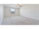 Bright bedroom with ceiling fan and carpet at 11216 Beeswing Pl, Riverview, FL 33578