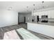 Open concept kitchen with island and stainless steel appliances at 1543 Mackinaw St, North Port, FL 34286
