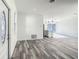 Bright and airy living room with wood-look flooring at 1543 Mackinaw St, North Port, FL 34286