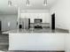 Modern kitchen with granite countertops and stainless steel appliances at 1543 Mackinaw St, North Port, FL 34286