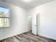 Bedroom with wood-look floors and closet at 1543 Mackinaw St, North Port, FL 34286