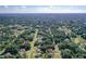 Aerial view of a large suburban neighborhood with houses nestled among trees at 1543 Mackinaw St, North Port, FL 34286