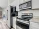 Stainless steel appliances and granite countertops at 1543 Mackinaw St, North Port, FL 34286