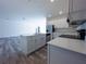 Open concept kitchen with island and stainless steel appliances at 1543 Mackinaw St, North Port, FL 34286