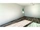 Bright bedroom with wood-look flooring at 1543 Mackinaw St, North Port, FL 34286