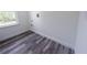 Laundry room with vinyl flooring and built-in shelving at 1543 Mackinaw St, North Port, FL 34286