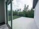 Concrete patio provides outdoor space with view of backyard at 1543 Mackinaw St, North Port, FL 34286