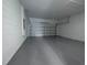 Garage with automatic door opener and epoxy floor at 1543 Mackinaw St, North Port, FL 34286