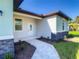 Inviting home exterior with a walkway and landscaping at 1543 Mackinaw St, North Port, FL 34286
