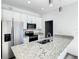 Modern kitchen with granite countertops and stainless steel appliances at 1543 Mackinaw St, North Port, FL 34286