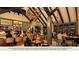 Community bar features a full liquor selection, pendant lighting, tall ceilings, and an inviting space for residents at 2515 Wise River Lane, Zephyrhills, FL 33539