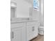 Bright bathroom featuring double vanity sinks, light countertops and modern fixtures at 2515 Wise River Lane, Zephyrhills, FL 33539