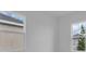 Bright bedroom with two windows showcasing the exterior of the property at 2515 Wise River Lane, Zephyrhills, FL 33539