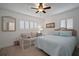 Bedroom with sofa and queen bed at 5287 99Th N Way, St Petersburg, FL 33708