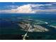 Wide aerial view of the island community and surrounding waterways at 903 Pinellas Bayway S # 302, Tierra Verde, FL 33715
