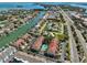 Beautiful aerial view showing community near waterfront canals, beach, and the inviting community pool at 903 Pinellas Bayway S # 302, Tierra Verde, FL 33715