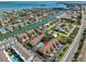 Stunning aerial shot highlighting the community's proximity to the canal, beach, and refreshing community pool at 903 Pinellas Bayway S # 302, Tierra Verde, FL 33715