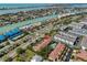 Aerial view of a coastal community with condos, a pool, and access to the intercoastal waterway at 903 Pinellas Bayway S # 302, Tierra Verde, FL 33715