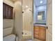 Bathroom featuring a glass enclosed shower, storage vanity and tiled floors at 903 Pinellas Bayway S # 302, Tierra Verde, FL 33715