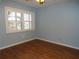 This bedroom features stylish floors, a bright window, and fresh paint at 903 Pinellas Bayway S # 302, Tierra Verde, FL 33715
