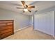 Bedroom featuring neutral walls, ceiling fan, and closet storage space at 903 Pinellas Bayway S # 302, Tierra Verde, FL 33715