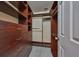 Custom walk-in closet includes storage and shelves at 903 Pinellas Bayway S # 302, Tierra Verde, FL 33715
