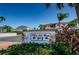 Community sign for Villa del Mar 903, set amidst lush greenery, providing a welcoming entrance at 903 Pinellas Bayway S # 302, Tierra Verde, FL 33715