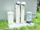 Water treatment system equipment placed on a concrete pad with surrounding grass at 1074 Kacerik St, North Port, FL 34288