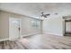 Bright living room with hardwood floors, ceiling fan and an entryway at 11335 Pickford St, Spring Hill, FL 34609