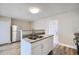 Kitchen with white cabinets, granite countertops, and a breakfast bar at 11335 Pickford St, Spring Hill, FL 34609