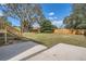 Large backyard with deck, patio, and mature trees at 11335 Pickford St, Spring Hill, FL 34609
