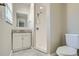 Clean bathroom with shower, toilet and granite vanity at 11335 Pickford St, Spring Hill, FL 34609