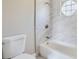 Updated bathroom with marble tile shower/tub combo and a new toilet at 11335 Pickford St, Spring Hill, FL 34609