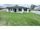 Exterior showing covered patio with a view of the backyard at 4683 Boston Ter, North Port, FL 34288