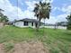Spacious backyard featuring a lush lawn and young trees, great for outdoor activities at 4683 Boston Ter, North Port, FL 34288