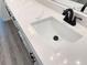 New bathroom featuring white cabinets with black hardware, a white sink, and marble countertop at 4683 Boston Ter, North Port, FL 34288