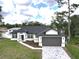 Beautiful single-story home with a modern design, paver driveway, and well-maintained landscaping at 4683 Boston Ter, North Port, FL 34288
